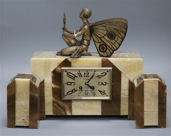 An Art Deco onyx clock set with a fairy surmount, height 34cm
